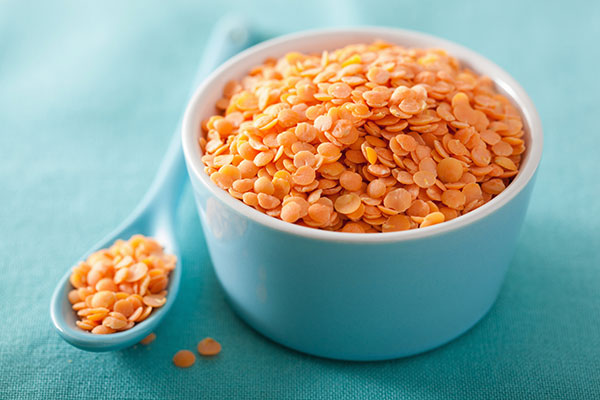 raw red lentils in a bowl